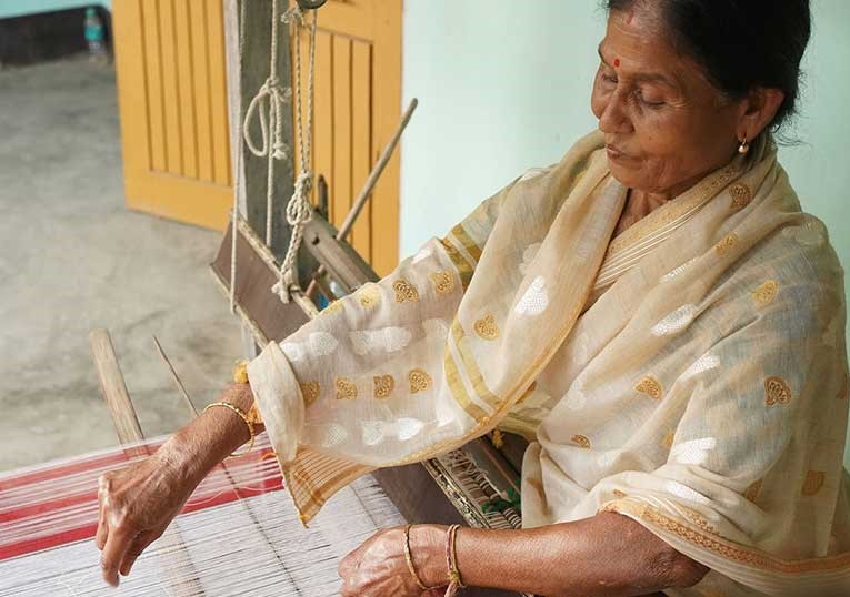 An artisan operates the loin loom, the pride and tradition of 16 hill tribes of North East India