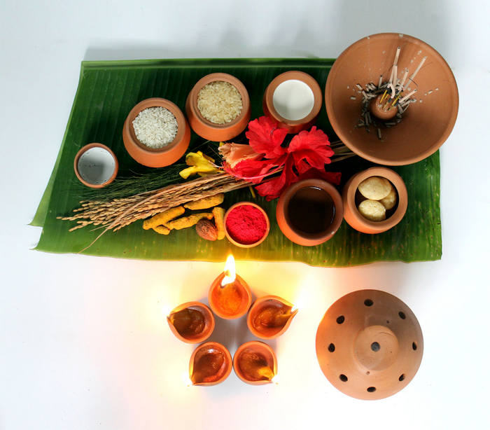 Pooja essentials displayed on a leaf