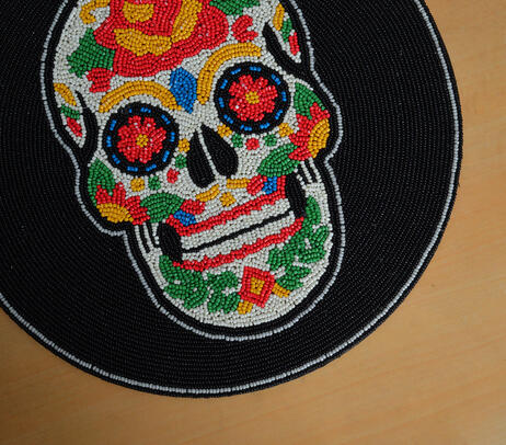 Beaded abstract skull placemat