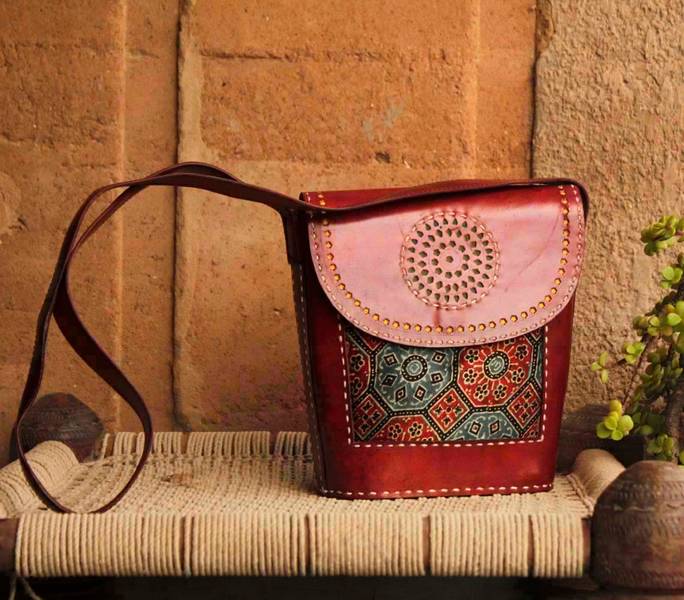 Hand stitched kutch craft leather bag with punch work