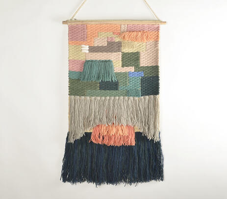 Handwoven woolen wall hanging with fringed tassels