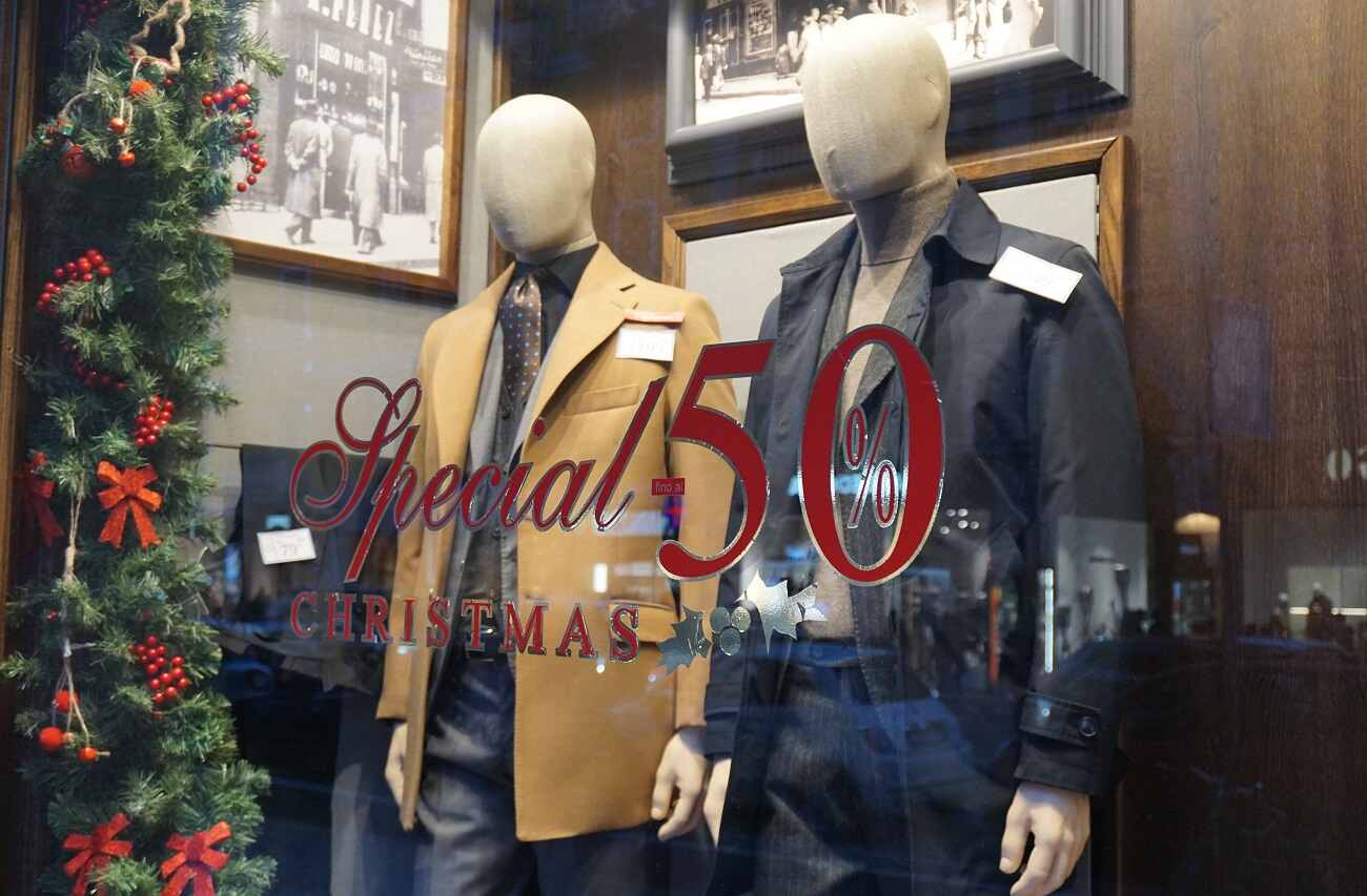 A christmas themed-storefront with 2 mannequins