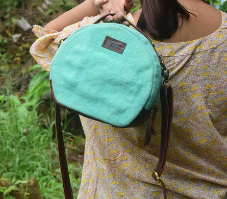 Hand stitched burlap turquoise sling bag