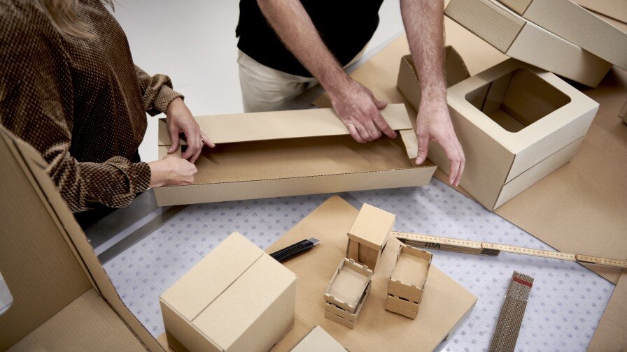 Packaging solutions experts with packaging prototypes