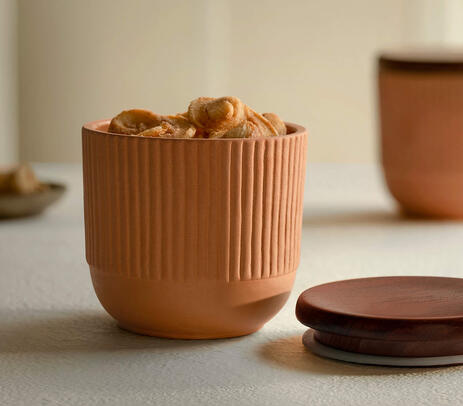Handmade terracotta jar with wooden lid