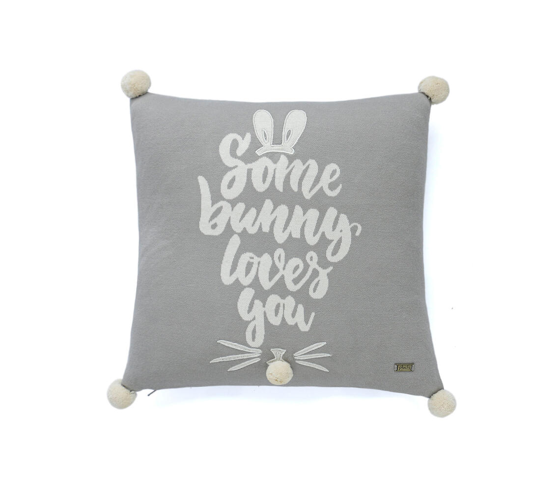 Knitted typographic cushion cover