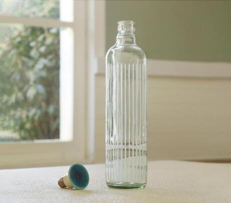 Glass cove bottle with ceramic stopper