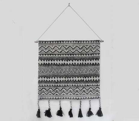 Block printed and embroidered wall hanging with tassels