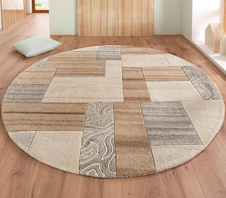 Hand tufted woolen & cotton round rug