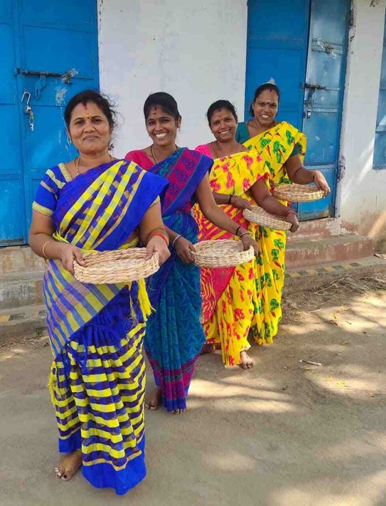 Women artisans with their handcrafted banana bark baskets