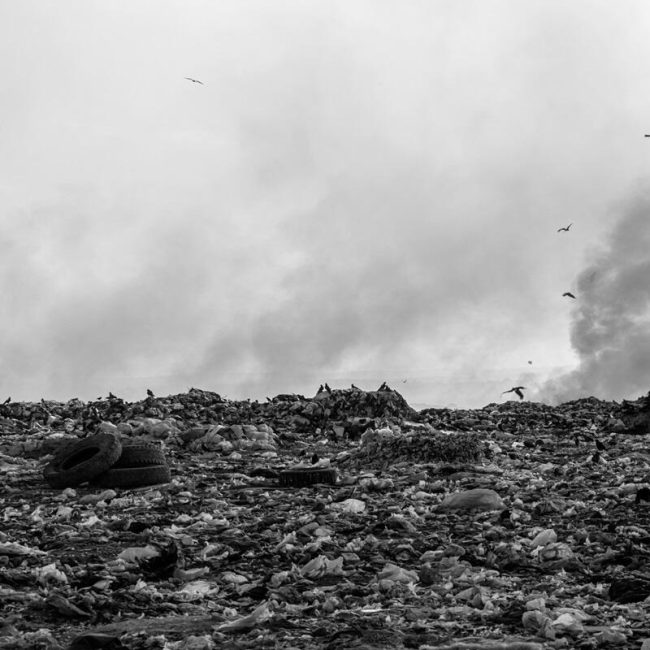 Black and white image of a landfill